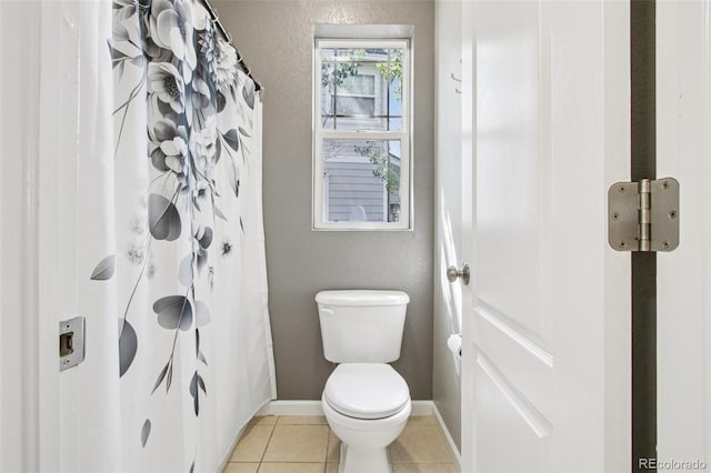 19677 E Vassar Dr, Aurora, CO 80013 - full bathroom featuring tile patterned floors and a shower with shower curtain