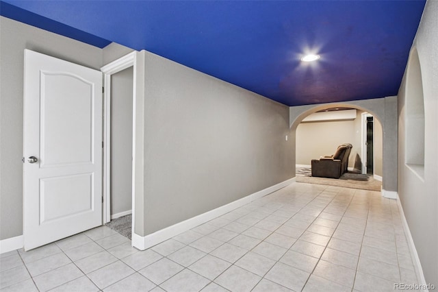 19677 E Vassar Dr, Aurora, CO 80013 - corridor with arched walkways, light tile patterned floors, and recessed lighting