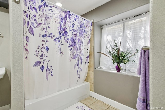 19677 E Vassar Dr, Aurora, CO 80013 - bathroom with shower / bath combo and tile patterned flooring