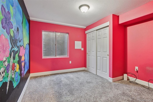 19677 E Vassar Dr, Aurora, CO 80013 - unfurnished bedroom featuring carpet floors, a closet, and a textured ceiling