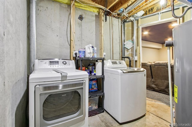 19677 E Vassar Dr, Aurora, CO 80013 - washroom featuring water heater and separate washer and dryer