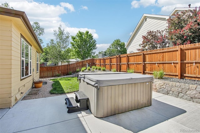 19677 E Vassar Dr, Aurora, CO 80013 - fenced backyard with a hot tub and a patio