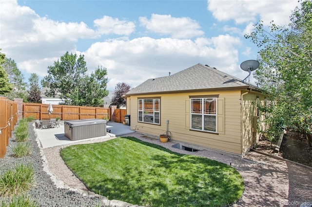 19677 E Vassar Dr, Aurora, CO 80013 - rear view of property with a hot tub, a patio, a fenced backyard, and roof with shingles