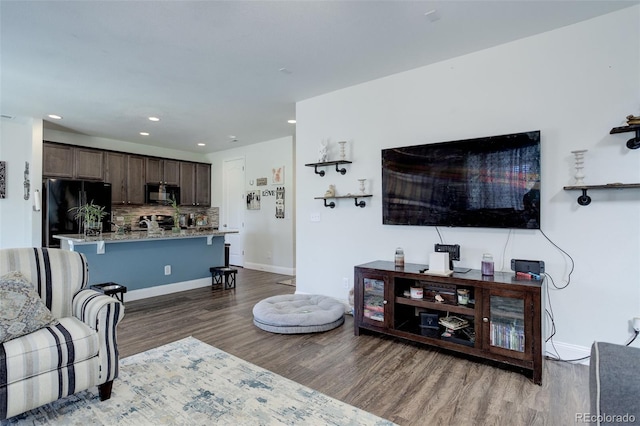 living room featuring dark hardwood / wood-style floors