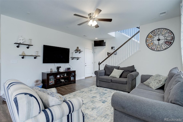 living room with dark hardwood / wood-style floors and ceiling fan