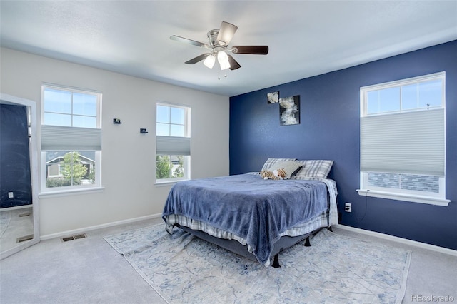 bedroom with light colored carpet and ceiling fan