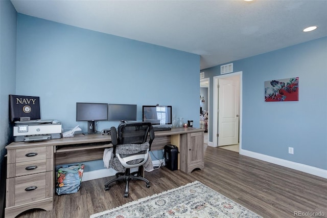 office with dark hardwood / wood-style flooring