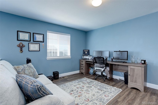 office with dark hardwood / wood-style flooring