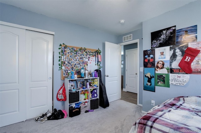 carpeted bedroom featuring a closet