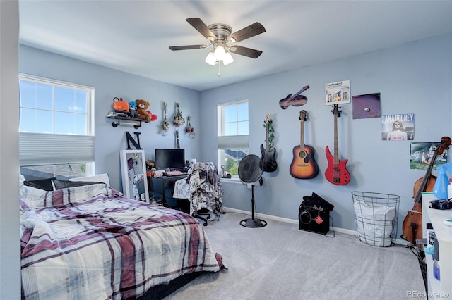 carpeted bedroom featuring ceiling fan