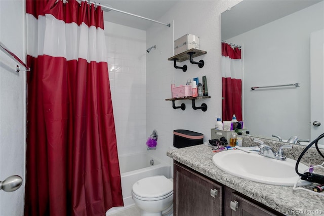 full bathroom with vanity, shower / tub combo, and toilet