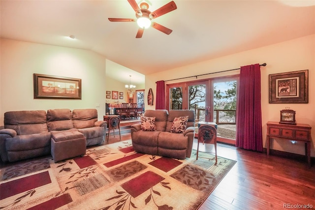 living room with ceiling fan with notable chandelier, french doors, vaulted ceiling, and wood finished floors