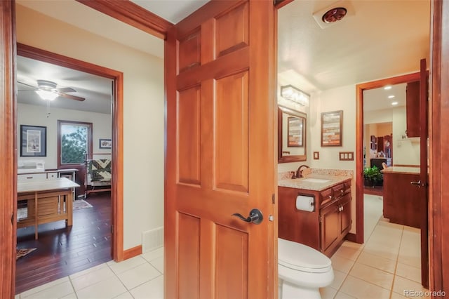 bathroom featuring visible vents, toilet, ceiling fan, tile patterned floors, and vanity