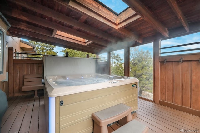 wooden terrace with a hot tub