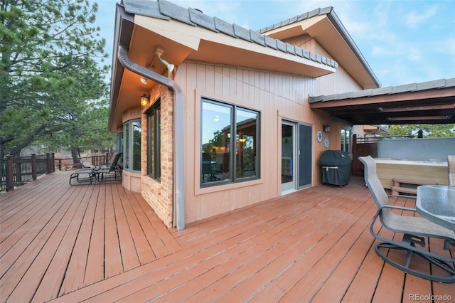 wooden terrace featuring grilling area