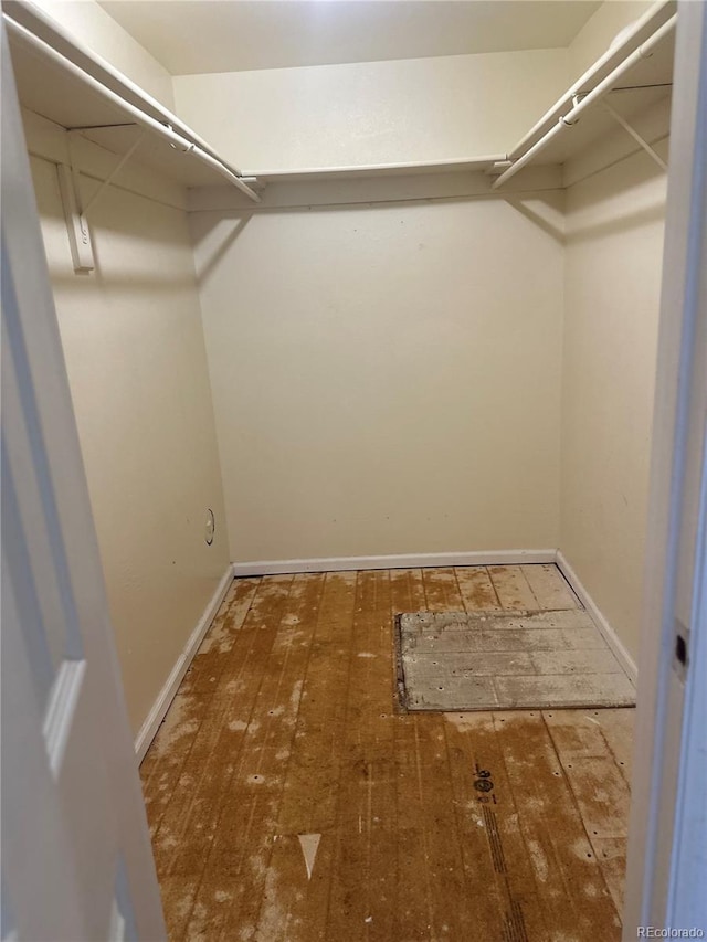 walk in closet featuring hardwood / wood-style floors