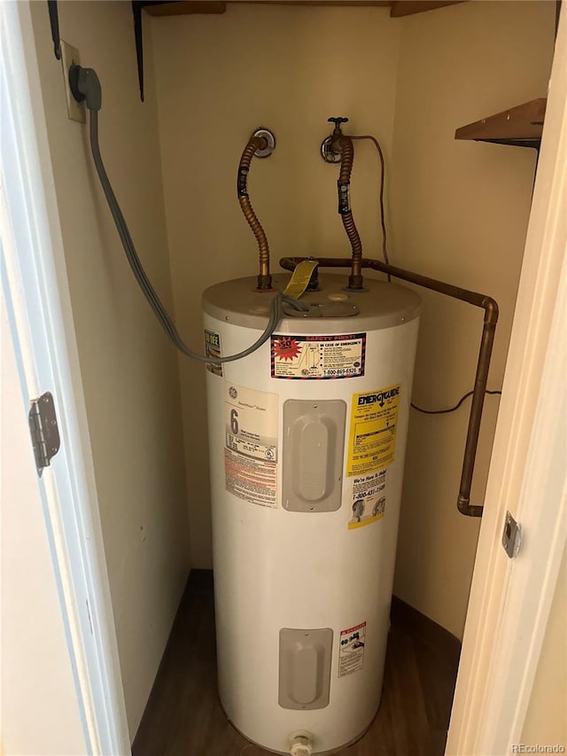 utility room with electric water heater