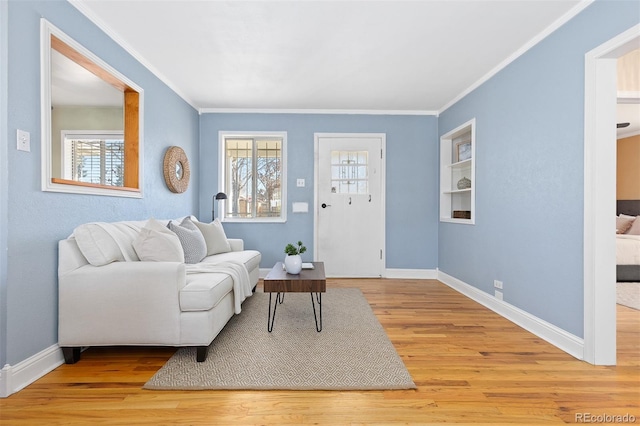 living room with wood finished floors, a wealth of natural light, and baseboards