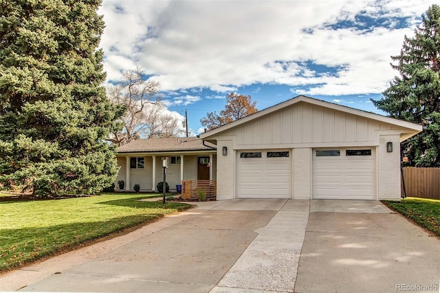 ranch-style house with a garage and a front lawn