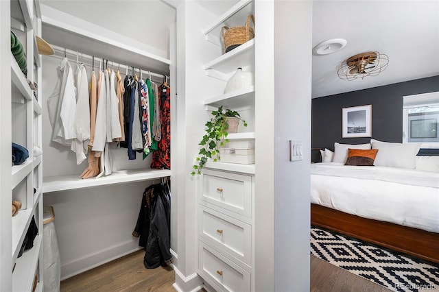 spacious closet with wood finished floors