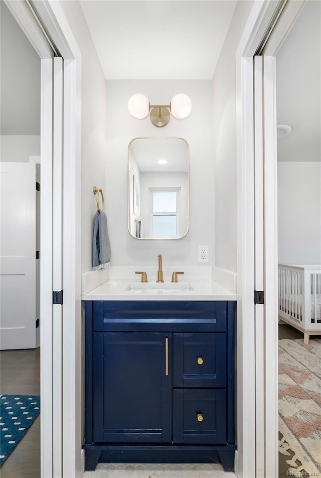 bathroom featuring vanity and wood finished floors