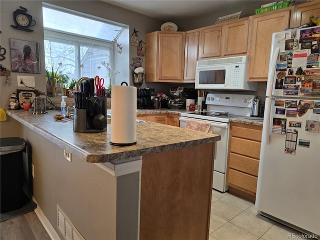 kitchen featuring light tile patterned floors, white appliances, kitchen peninsula, and light brown cabinetry