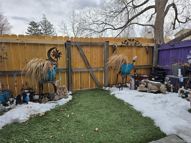 view of yard layered in snow