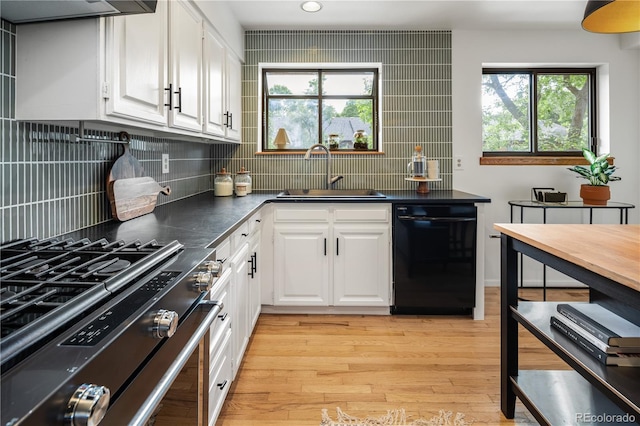 9400 E Iliff Ave Unit 292, Denver, CO 80231 - kitchen featuring black dishwasher, stainless steel range with gas stovetop, extractor fan, white cabinetry, and recessed lighting