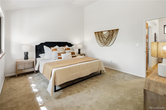 9400 E Iliff Ave Unit 292, Denver, CO 80231 - bedroom with vaulted ceiling and carpet flooring