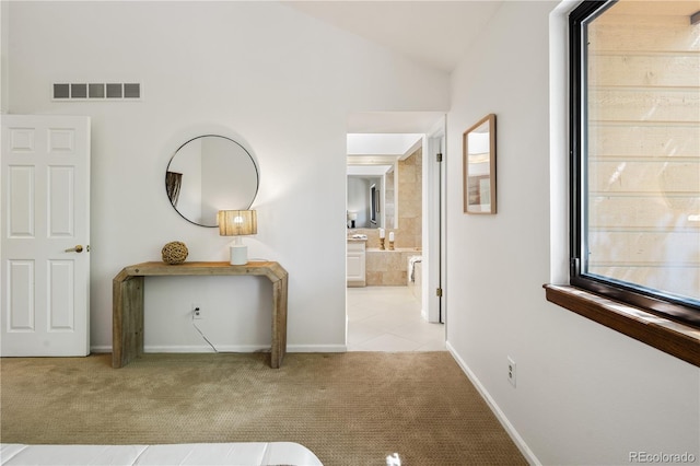 9400 E Iliff Ave Unit 292, Denver, CO 80231 - hall with carpet flooring, lofted ceiling, and tile patterned flooring