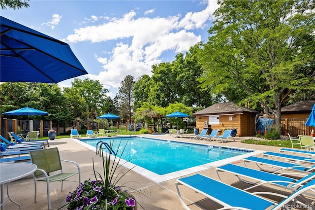 9400 E Iliff Ave Unit 292, Denver, CO 80231 - community pool with a patio and an outdoor structure
