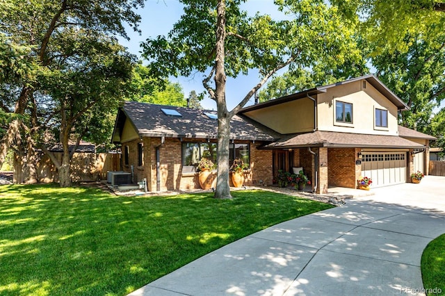 6740 S Windermere St, Littleton, CO 80120 - view of front of home featuring an attached garage, concrete driveway, brick siding, cooling unit, and stucco siding