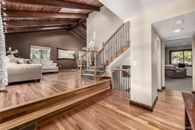 6740 S Windermere St, Littleton, CO 80120 - stairs with wood finished floors, baseboards, and wooden ceiling