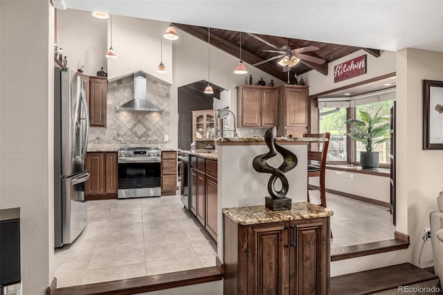 6740 S Windermere St, Littleton, CO 80120 - kitchen with appliances with stainless steel finishes, wall chimney range hood, tasteful backsplash, light tile patterned floors, and wooden ceiling