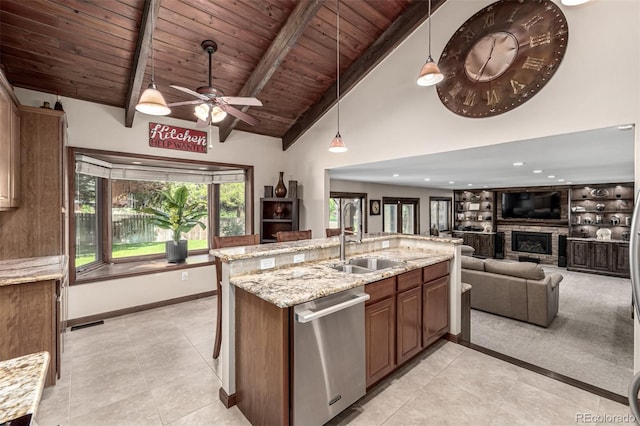6740 S Windermere St, Littleton, CO 80120 - kitchen featuring stainless steel dishwasher, a sink, wood ceiling with exposed beams, a fireplace, and light tile patterned floors