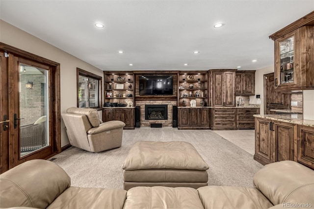 6740 S Windermere St, Littleton, CO 80120 - living area with recessed lighting, light colored carpet, and a stone fireplace