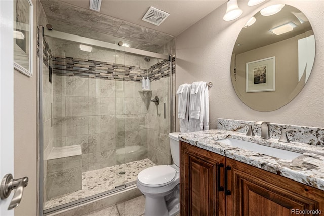 6740 S Windermere St, Littleton, CO 80120 - bathroom with vanity, toilet, and a stall shower