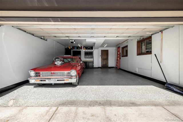 6740 S Windermere St, Littleton, CO 80120 - garage with baseboards and a garage door opener