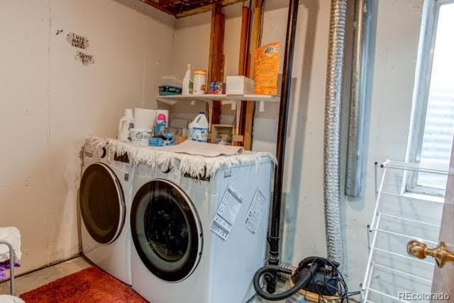 laundry area with washing machine and dryer and laundry area