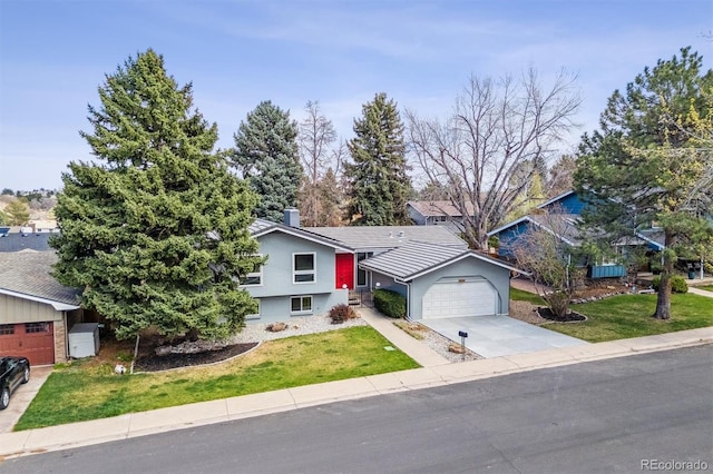 single story home with a garage, a front lawn, stucco siding, and concrete driveway
