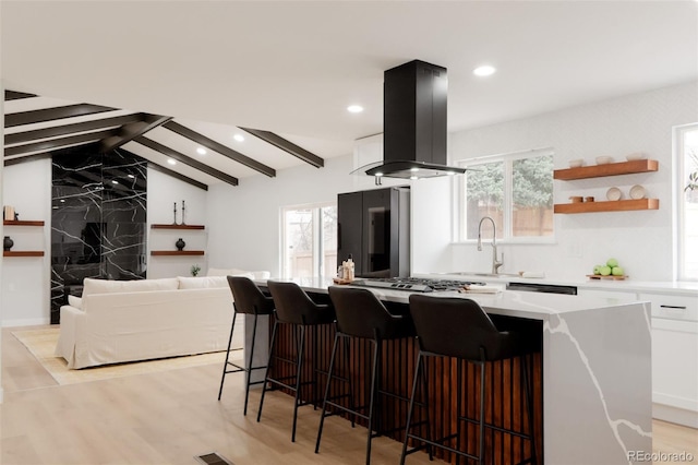 kitchen featuring vaulted ceiling with beams, white cabinets, light countertops, smart refrigerator, and island exhaust hood