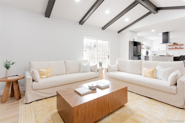 living area with recessed lighting, lofted ceiling with beams, and light wood finished floors