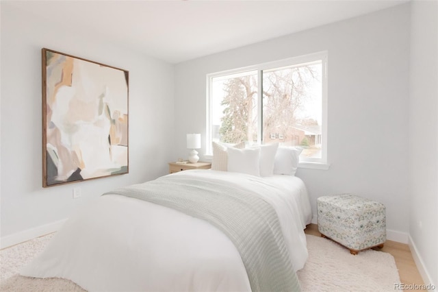 bedroom featuring baseboards