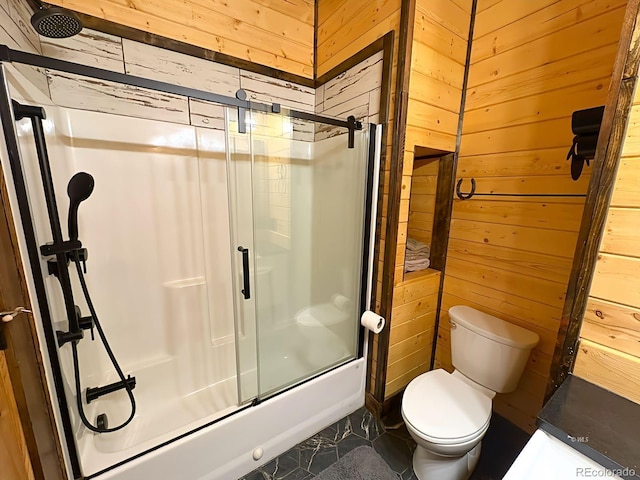 full bath with toilet, wood walls, and a shower with door
