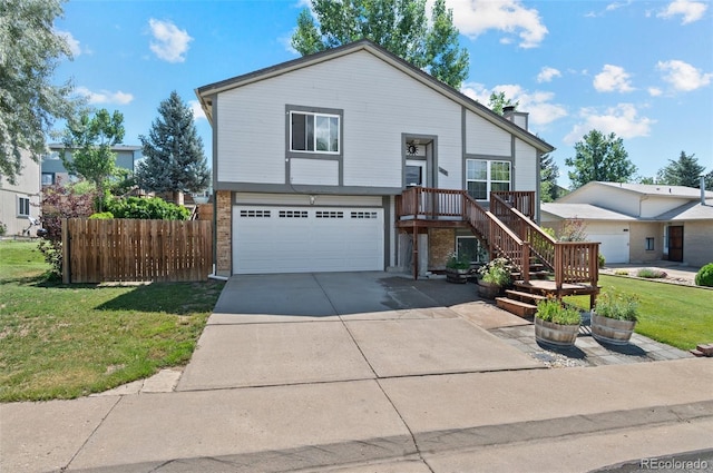 9648 Lane St, Thornton, CO 80260 - view of front facade with a garage, concrete driveway, brick siding, and a chimney