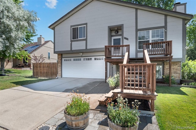 9648 Lane St, Thornton, CO 80260 - view of front of house featuring a garage, concrete driveway, a chimney, stairs, and brick siding