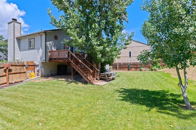 9648 Lane St, Thornton, CO 80260 - fenced backyard featuring stairs and a wooden deck