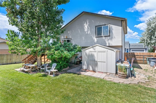 9648 Lane St, Thornton, CO 80260 - rear view of property with a storage unit and a fenced backyard