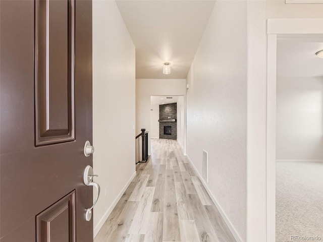 hall with light hardwood / wood-style floors