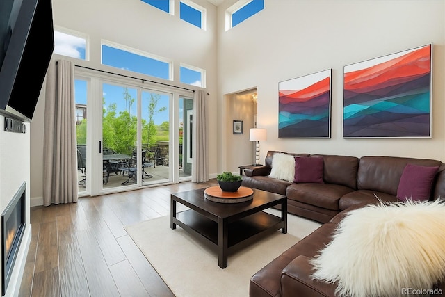 1882 W 67th Ave, Denver, CO 80221 - living area featuring hardwood / wood-style flooring and a towering ceiling